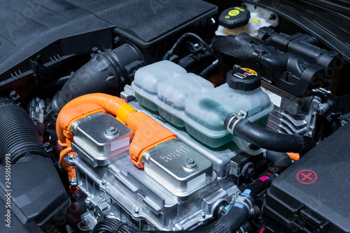 Powertrain of the electric, hybrid car with. Car maintenance. Blue toned.