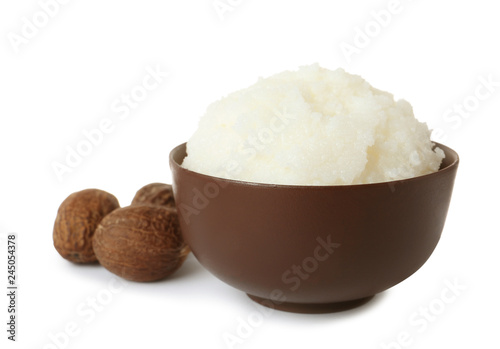 Fototapeta Naklejka Na Ścianę i Meble -  Shea butter in bowl and nuts isolated on white