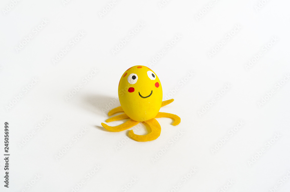 Easter holiday concept with cute handmade eggs: sea animal yellow octopus. Easter holiday concept with cute handmade eggs: sea animal yellow octopus.