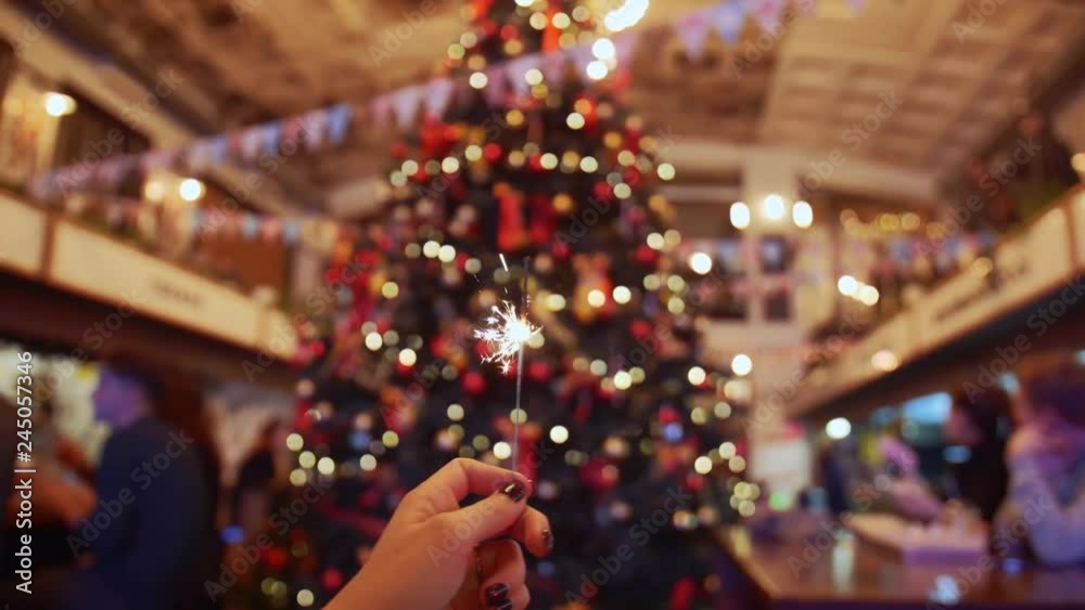 POV shot of bengal light against the background of a Christmas tree, slow motion POV shot of bengal light against the background of a Christmas tree, slow motion