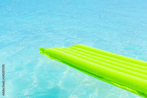 Swimming color green mattress on turquoise sea © photopixel