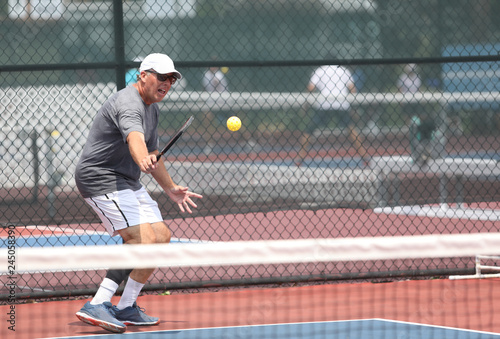 A gentleman competes in a pickleball tournament