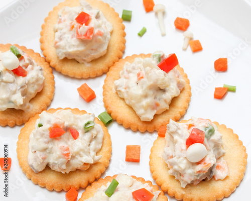 Tasty crackers with cream cheese,carrot.Healthy snacks, on dish