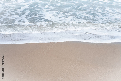 The beach background,white sea wave,clear sand,beauty by nature