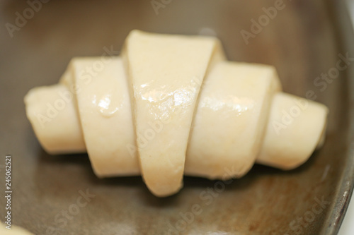 traditional St martin's croissants being prepared, croissants rolled lying on plate - Image photo