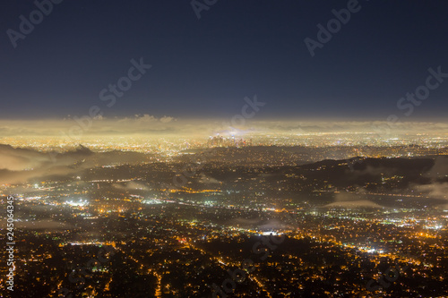 Night fog view of Pasadena and Los Angeles from peak in the San Gabriel Mountains. 