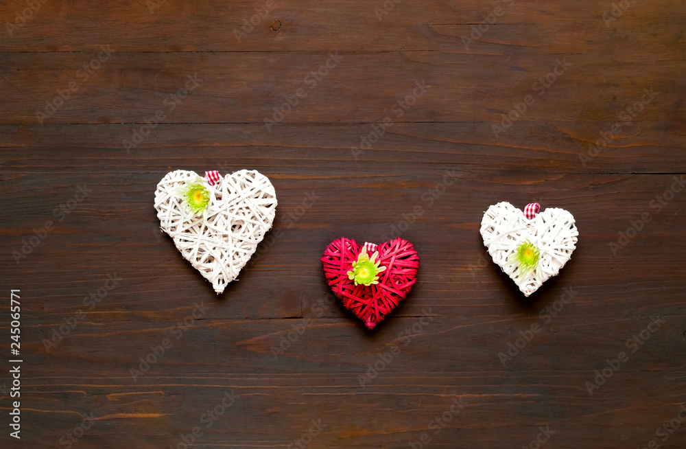 Chrysanthemums and decorative hearts on wooden background. Festive decor. 
