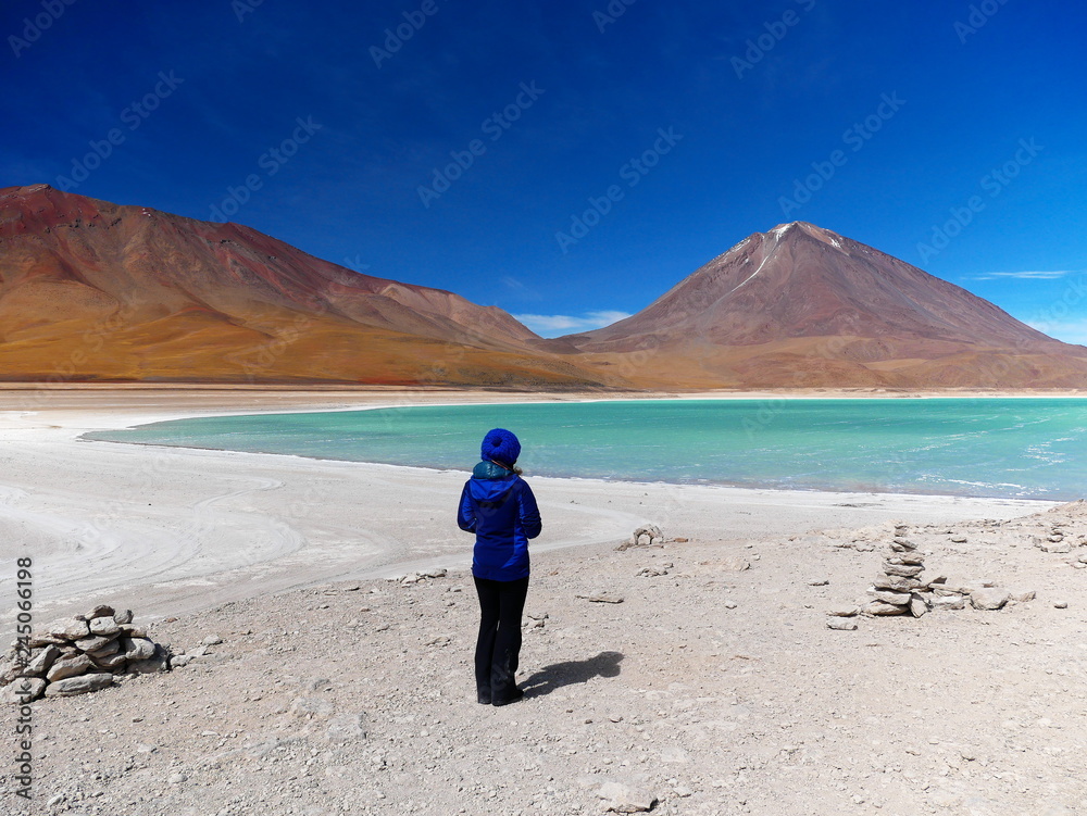 Young woman at Laguna verde and Vulcan Licancabur