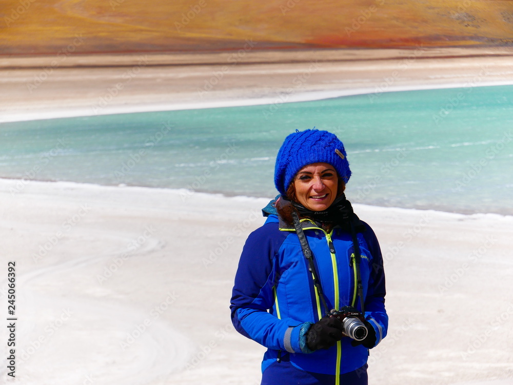 Young woman at Laguna verde and Vulcan Licancabur