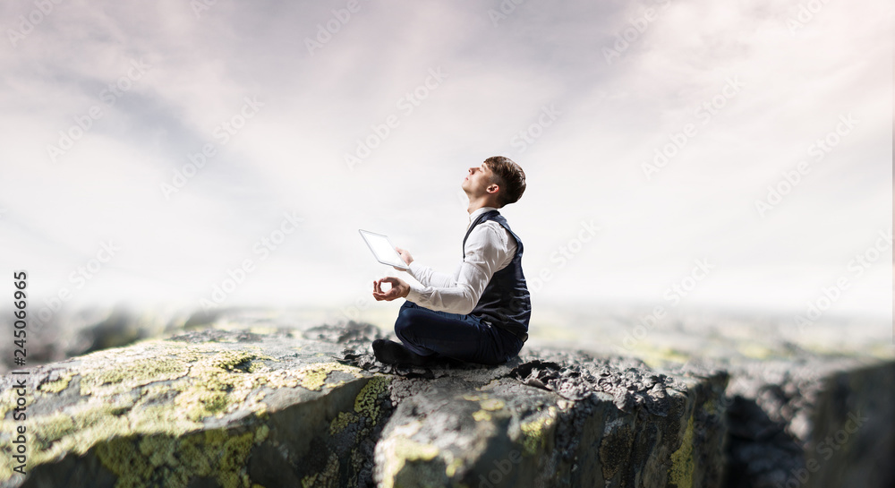 Businessman in lotus pose. Mixed media