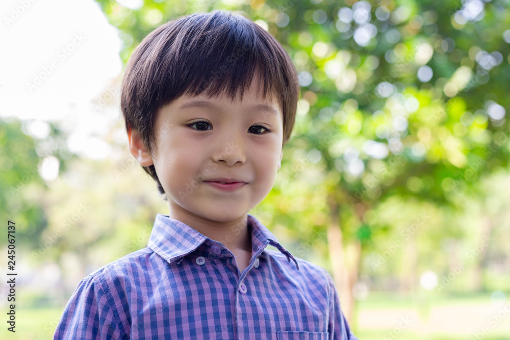Portrait handsome little boy. Attractive handsome young boy feels happy when cute kid go to outdoor. He is 3 years old. Little child is mixed race, half Thai, half English. He is kindergarten student Portrait handsome little boy. Attractive handsome young boy feels happy when cute kid go to outdoor. He is 3 years old. Little child is mixed race, half Thai, half English. He is kindergarten student