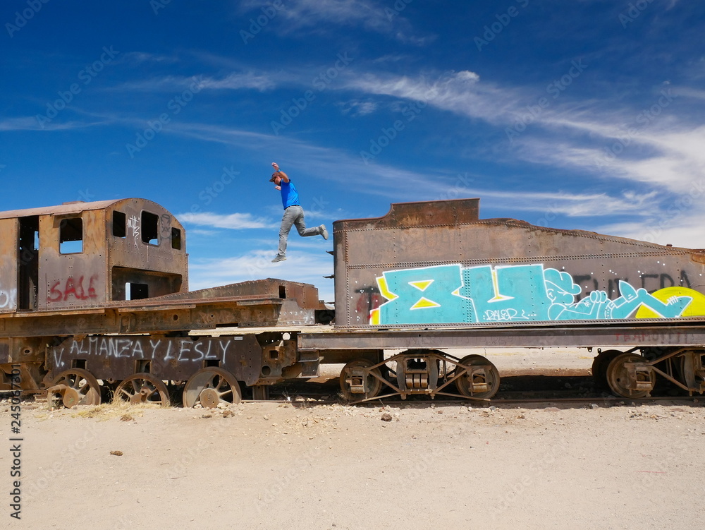 Jumping the train. Train cemetary near Uyuni, Bolovia