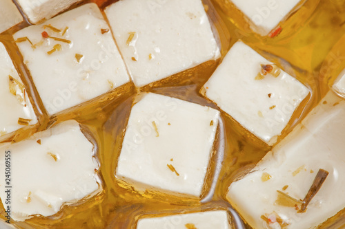 Feta cheese in oil with spices photo