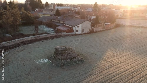 Drone footage of an ancient unbreakable wall located in a field in Centallo, a small town in northwest of Italy. photo