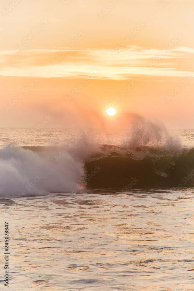 Narigama Beach. Stunning sunset on the beach overlooking the ocean and the waves.  