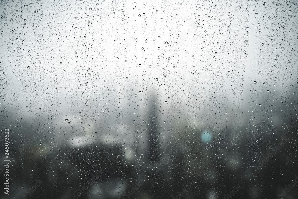 Rain on Window with New York Skyline in the Background
