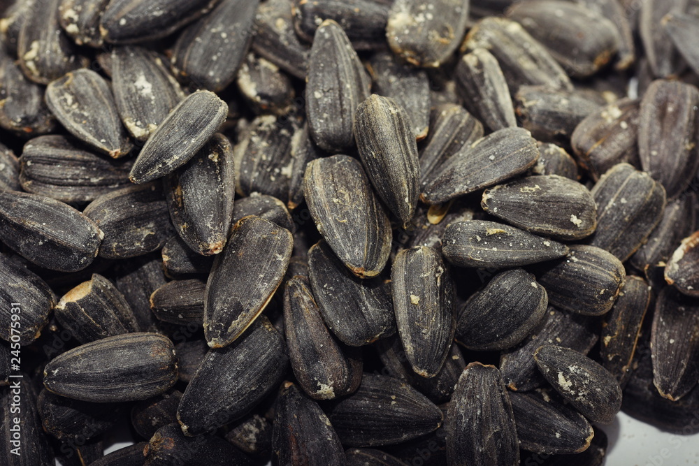 Roasted salted black sunflower seed background Roasted salted black sunflower seed background
