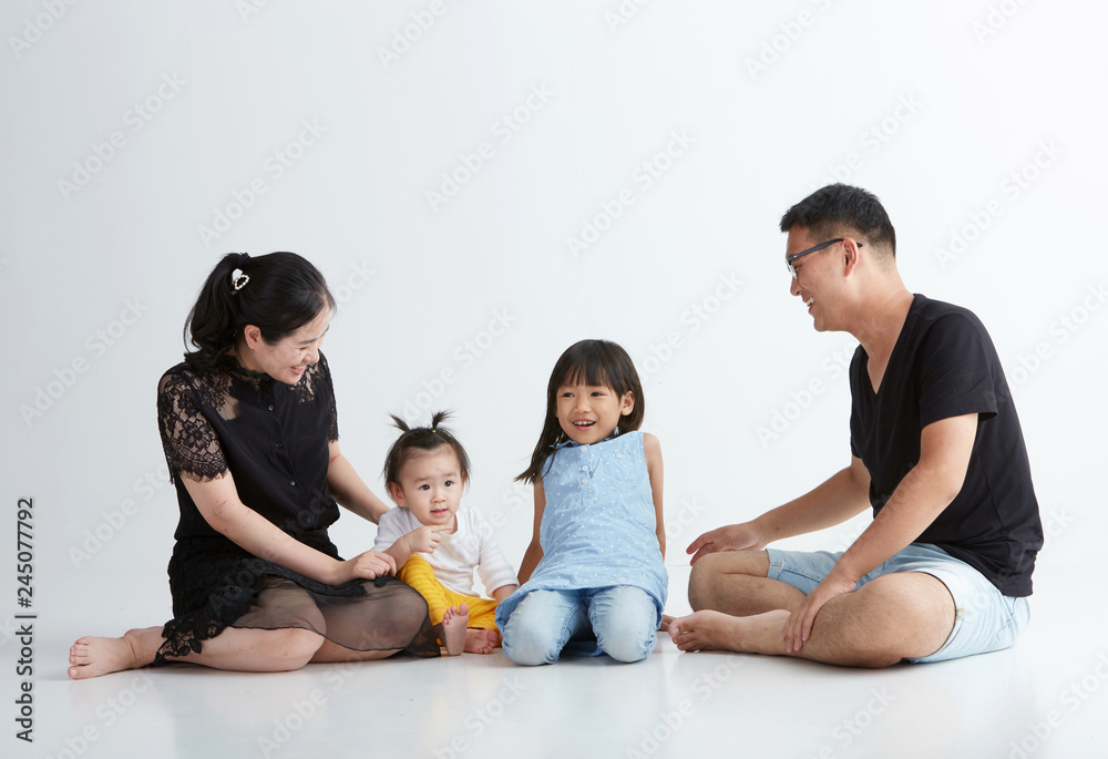 Asian family of four on white background Asian family of four on white background