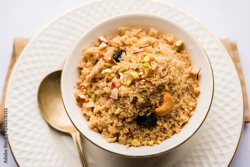 Semolina Halwa / Sooji ka Halva or sweet Rava Sheera or shira - Indian festival sweet made of semolina, nuts and Ghee Semolina Halwa / Sooji ka Halva or sweet Rava Sheera or shira - Indian festival sweet made of semolina, nuts and Ghee