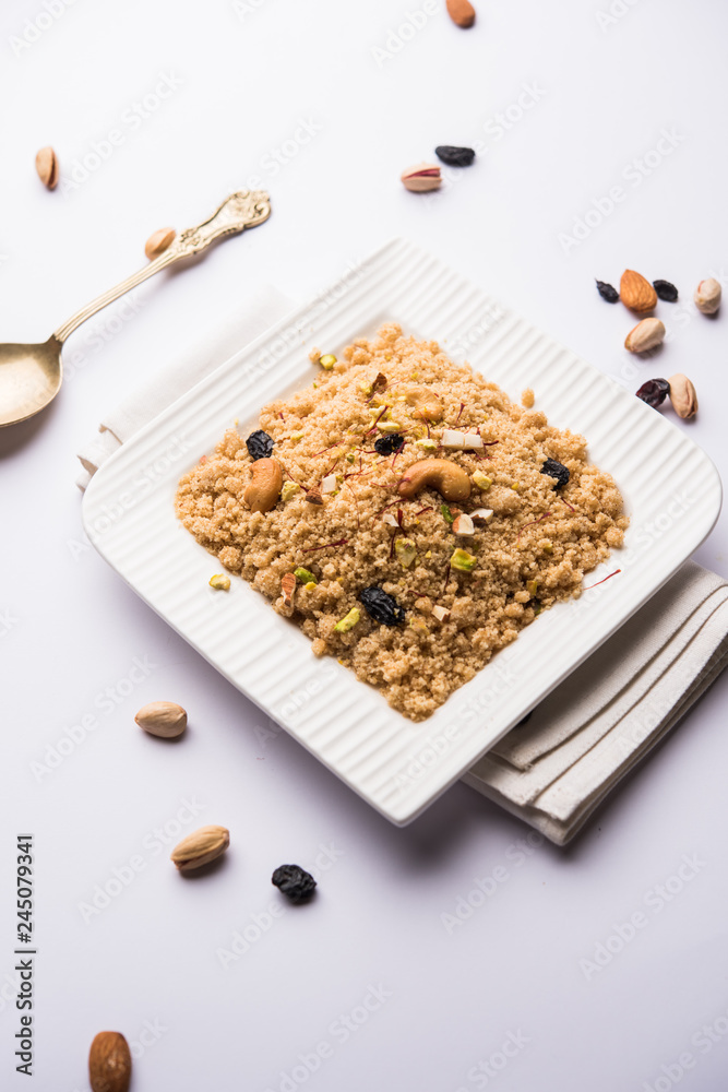 Semolina Halwa / Sooji ka Halva or sweet Rava Sheera or shira - Indian festival sweet made of semolina, nuts and Ghee Semolina Halwa / Sooji ka Halva or sweet Rava Sheera or shira - Indian festival sweet made of semolina, nuts and Ghee
