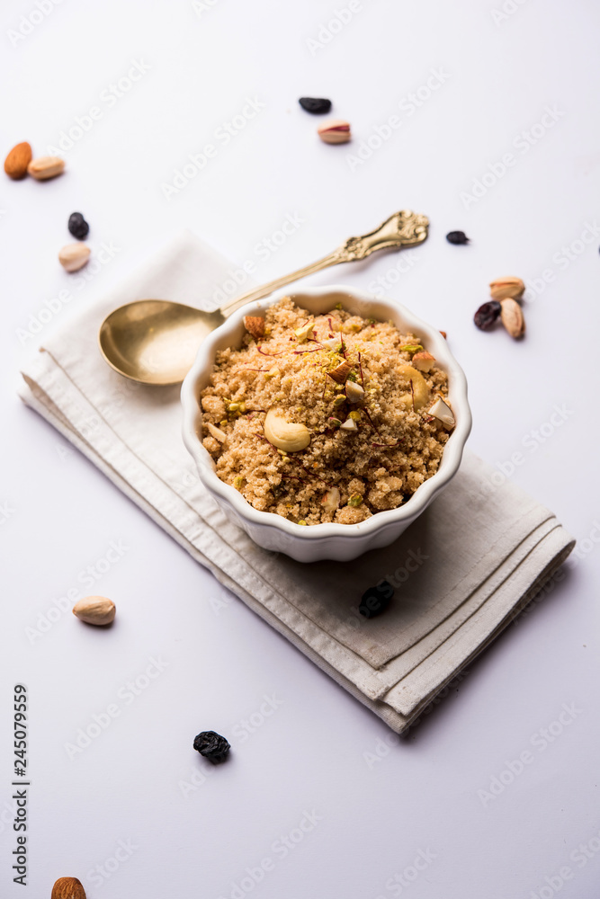 Semolina Halwa / Sooji ka Halva or sweet Rava Sheera or shira - Indian festival sweet made of semolina, nuts and Ghee Semolina Halwa / Sooji ka Halva or sweet Rava Sheera or shira - Indian festival sweet made of semolina, nuts and Ghee