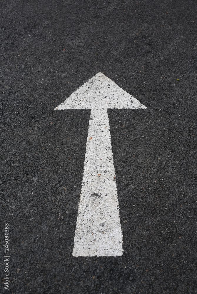 arrow marking sign on a road