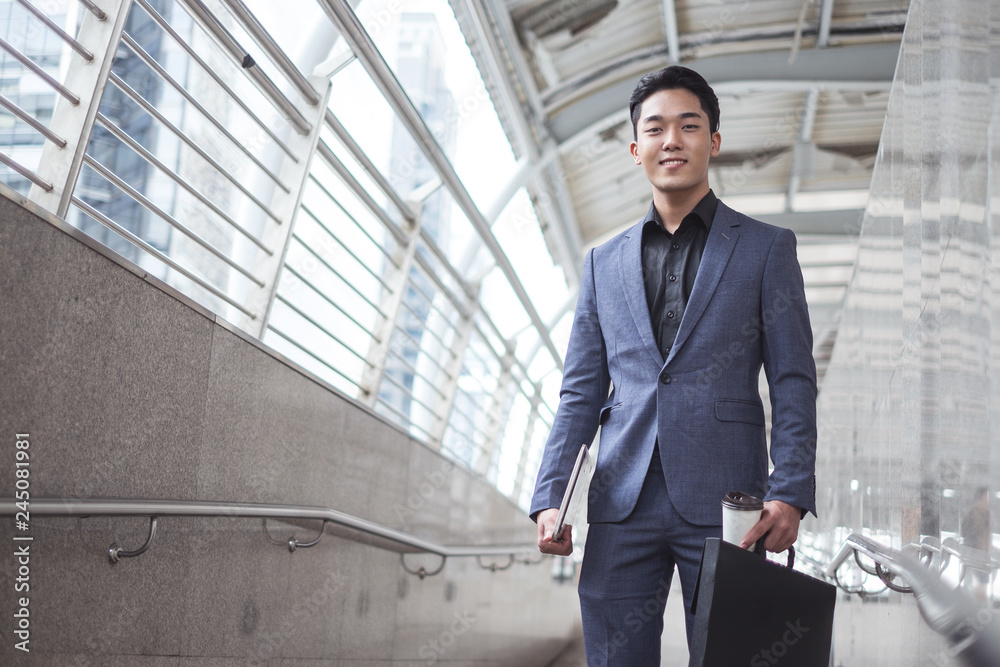 Young smart successful businessman hold mobile laptop notebook prepare to present new business project. Young smart successful businessman hold mobile laptop notebook prepare to present new business project.