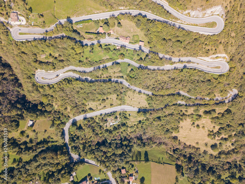 Up and down drone aerial view of the mountain road in Italy from the village of Nembro to Selvino. Amazing aerial view of the mountain bends creating beautiful shapes