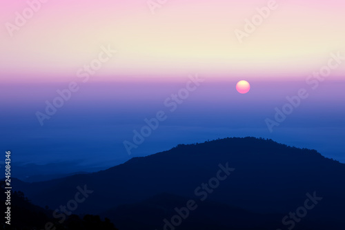 Sunrise and beautiful sky with silhouette of mountain background.