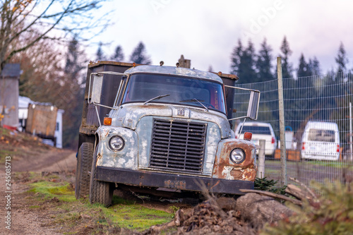 Hillsboro  Oregon   USA - December 02 2018  Abandoned old rusty Harvest International Loadstart truck a farm field. The truck has extra logo modded by the owner above the radiator grill - Grandokee