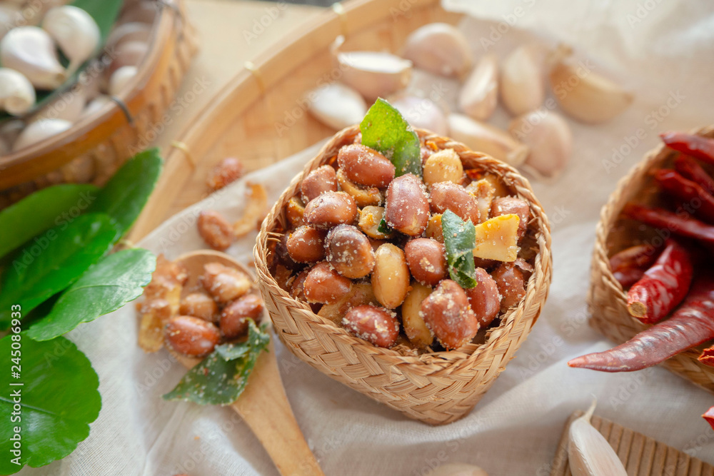 Seasoning fried peanut bean in a basket, peanut snack, food background, Thai food/ OLYMPUS DIGITAL CAMERA Seasoning fried peanut bean in a basket, peanut snack, food background, Thai food/ OLYMPUS DIGITAL CAMERA