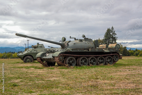 McMinville, Oregon \ USA - September 15 2013: Soviet T-55 Main battle tank tank on a field with BRDM-2 amphibious armored patrol car in the background