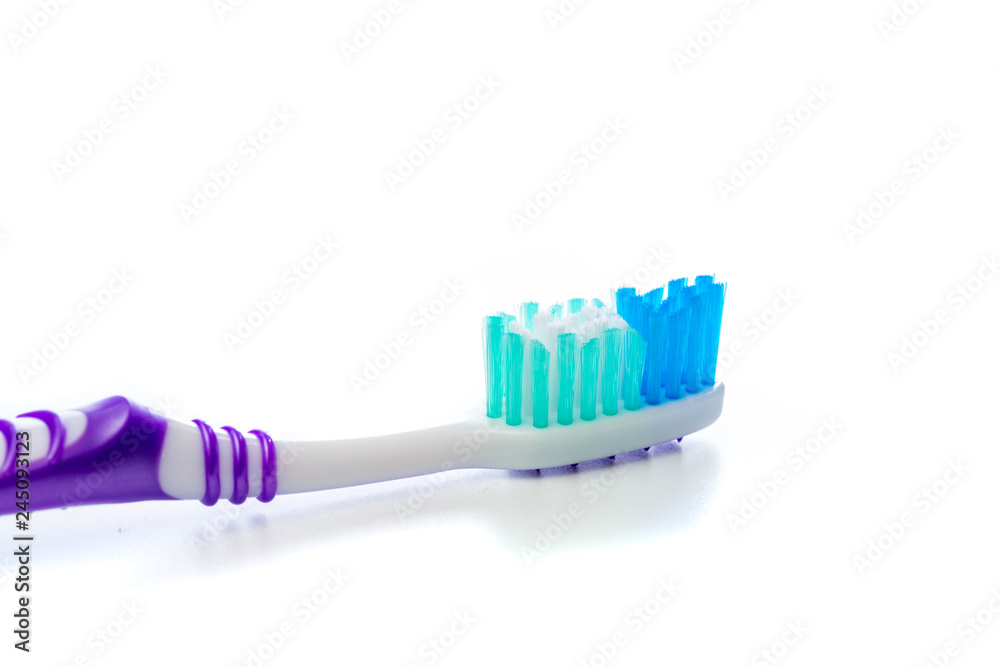 colored toothbrush on an isolated background, close up colored toothbrush on an isolated background, close up