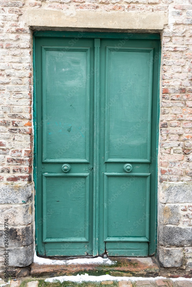 old wooden door in the wall