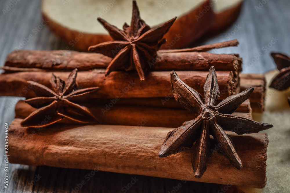Star anise, cinnamon and apple on mader background. Star anise, cinnamon and apple on mader background.