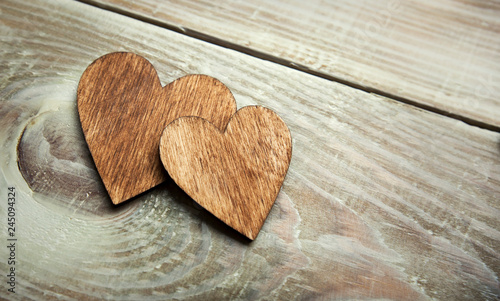 One wooden heart on the wooden table