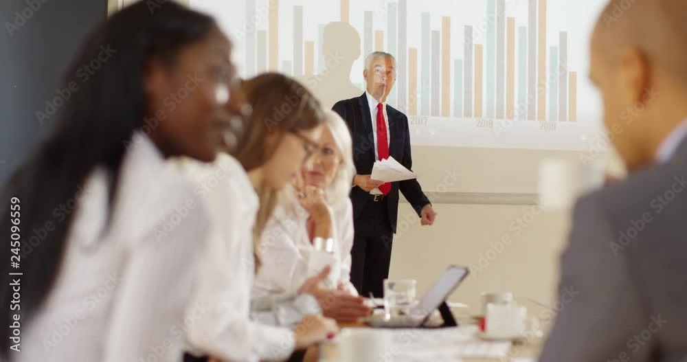 4K Unhappy businessman trying to give a presentation with coworkers ignoring him. Humorous workplace stress concept. Slow motion. 4K Unhappy businessman trying to give a presentation with coworkers ignoring him. Humorous workplace stress concept. Slow motion.