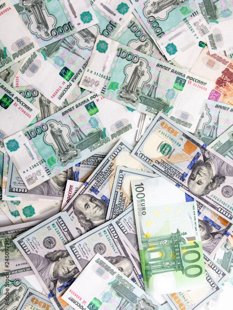 Dollars and Russian rubles. Euro on the table as background Dollars and Russian rubles. Euro on the table as background
