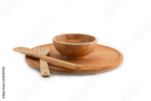 Wooden plate, bowl, spoon and fork isolated on white background bamboo top view