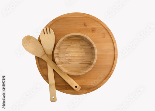 Wooden plate, bowl, spoon and fork isolated on white background bamboo top view