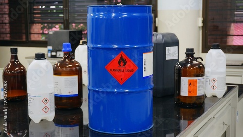 Blue color hazardous dangerous chemical drum barrels with red flammable liquid warning label and  Variety type of flammable liquid container