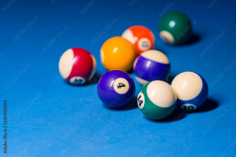 Billiard balls on pool blue table - sport background Billiard balls on pool blue table - sport background
