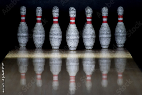 Ten pin bowling alley background. Closeup of tenpin row on a lan photo