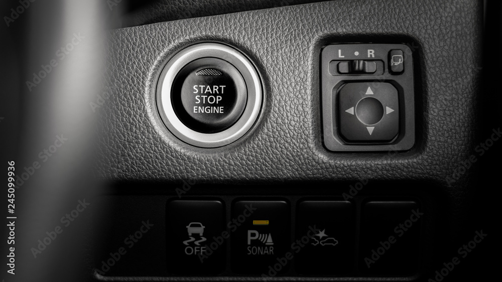 close up of a pressing the start/stop engine button at a car. close up of a pressing the start/stop engine button at a car.