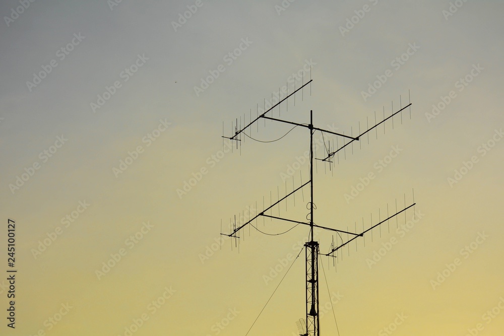 televisions antennas with sunset background televisions antennas with sunset background