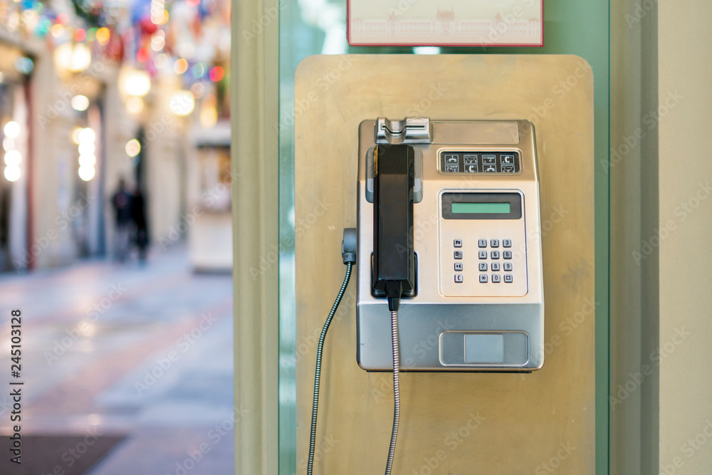using of public payphone. old payphone in the street f using of public payphone. old payphone in the street f