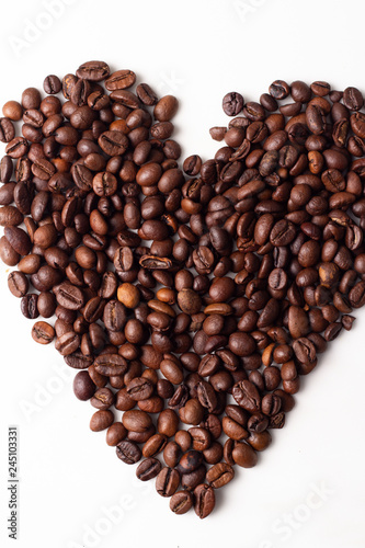 heart of coffee beans on a white background close-up.