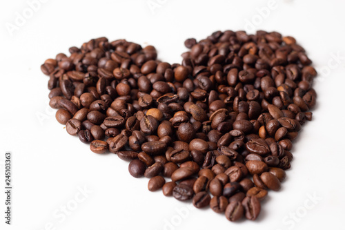 heart of coffee beans on white background.