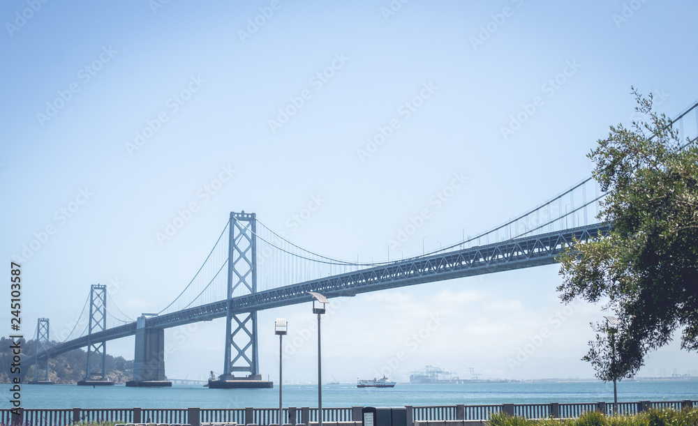 Bridge above water near coast in sunny day Bridge above water near coast in sunny day