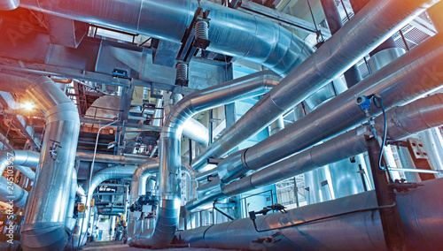 Foto equipment, cables and piping as found inside of a modern industrial power plant